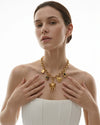 Woman wearing the Siddhi PVD Real Gold Plated statement necklace with elephant and symbolic charms by Eda Jewels Dubai