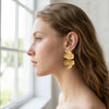 Eda Jewels Dubai gold plated statement earring featuring a textured, tiered abstract design