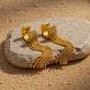 Ria gold plated hoop earrings featuring cascading monochrome gold beaded fringe chains on a stone by Eda Jewels Dubai