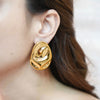 Gold-plated Alia abstract large statement earrings by Eda Jewels Dubai. Perfect for daily or party wear and gifting