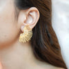 Alina gold plated sunburst fan stud earrings by Eda Jewels Dubai. Perfect statement daily wear gifting piece.