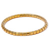 Ame gold plated segmented tube stretch bangle by Eda Jewels Dubai. Perfect for stacking with watch.