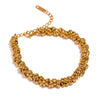 Athena gold plated twisted link chain bracelet by Eda Jewels Dubai. Perfect for stacking with watch.