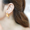 Ayla gold plated textured molten gold chunky hoop earrings by Eda Jewels Dubai. Perfect for daily wear and gifting.