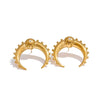 Gold plated Cynthia earrings by Eda Jewels, featuring a crescent moon design with crystal detail. Perfect for everyday wear or gifting