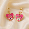 Eliana gold plated pink heart evil eye hoop earrings with crystal accents by Eda Jewels Dubai