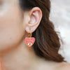 Eliana gold plated pink heart evil eye hoop earrings by Eda Jewels Dubai. Perfect daily wear gifting piece.