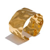 Gaia gold plated wavy molten chunky cuff bracelet by Eda Jewels Dubai. Perfect statement daily wear gifting piece.