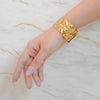 Gaia gold plated wide wavy chunky cuff statement bracelet. Perfect daily wear gifting piece by Eda Jewels Dubai.