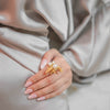 Galene gold plated ocean charm and pearl statement ring worn by a model by Eda Jewels Dubai