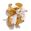 Galene gold plated statement ring featuring a seahorse, starfish, shell charms, and white pearls by Eda Jewels Dubai 