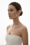 Woman wearing the Greta pearl PVD Real Gold Plated statement ear cuff by Eda Jewels Dubai