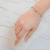 Iris gold plated evil eye turquoise charm bracelet perfect for stacking. Daily wear gifting by Eda Jewels dubai.