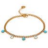 Iris gold plated evil eye turquoise charm bracelet by Eda Jewels Dubai. Perfect for stacking with watch.