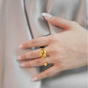 Isabella everyday gold plated open wrap statement ring featuring an abstract molten teardrop design worn by a model by Eda Jewels Dubai