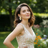 June gold plated daisy enamel earrings worn by a model in a garden shoot by Eda Jewels Dubai