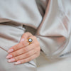 Kaya gold plated statement ring featuring a central blue and white enamel evil eye talisman on a multi-band setting by Eda Jewels Dubai