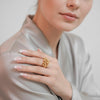 Eda Jewels Dubai gold plated textured bubble cluster statement ring worn by a model.