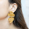 Gold-plated Lila textured statement earrings by Eda Jewels Dubai. Perfect for daily or party wear and gifting