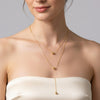 Lume gold plated minimalist layered drop necklace featuring delicate gold ball beads worn by a model by Eda Jewels Dubai