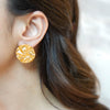 Gold-plated round Maha textured stud earrings by Eda Jewels Dubai. Perfect for daily wear and gifting