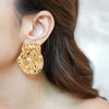 Gold-plated Mia textured statement earrings by Eda Jewels Dubai. Perfect for daily or party wear and gifting
