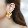 Mila gold plated crumpled textured earrings by Eda Jewels Dubai. Perfect for daily wear office wear and gifting.