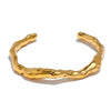 Noa gold plated organic molten cuff bangle by Eda Jewels Dubai. Perfect statement daily wear gifting piece.