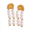 Shelly gold plated shell and pearl statement earrings by Eda Jewels Dubai, an elegant beach inspired design perfect for gifting