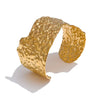 Terra gold plated crumpled molten cuff bracelet by Eda Jewels Dubai. Perfect statement daily wear gifting piece.
