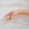Terra gold plated crumpled molten chunky cuff bracelet. Perfect statement daily wear or gifting piece by Eda Jewels Dubai.