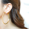 Tia gold plated abstract layered hoop earrings by Eda Jewels Dubai. Perfect statement piece daily wear gifting.