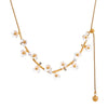 Vira gold plated necklace featuring delicate white flowers and pearls, elegant for everyday wear and perfect for gifting by Eda Jewels Dubai