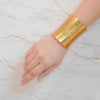 Zoyi gold plated wide chunky hammered cuff bracelet. Perfect statement party wear piece by Eda Jewels.